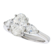 Oval Diamond with Pear Shapes in Platinum Ring