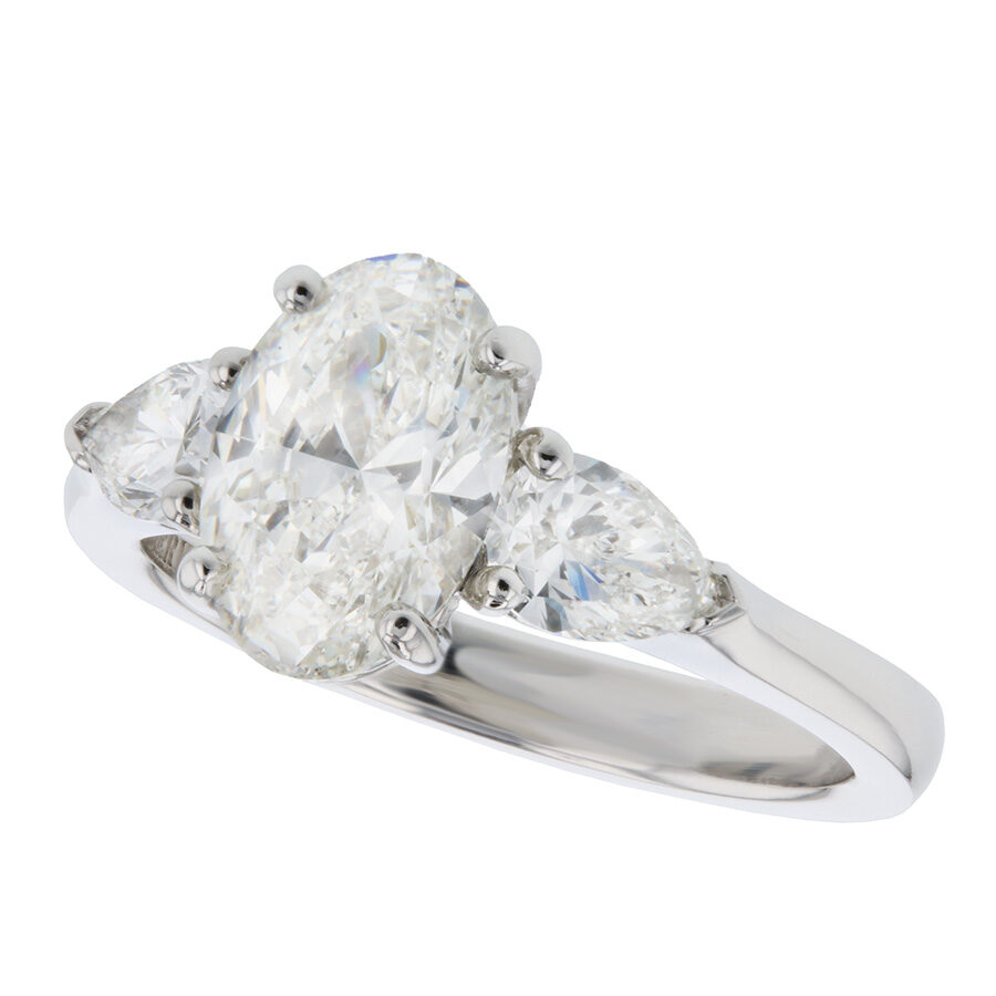 Oval Diamond with Pear Shapes in Platinum Ring