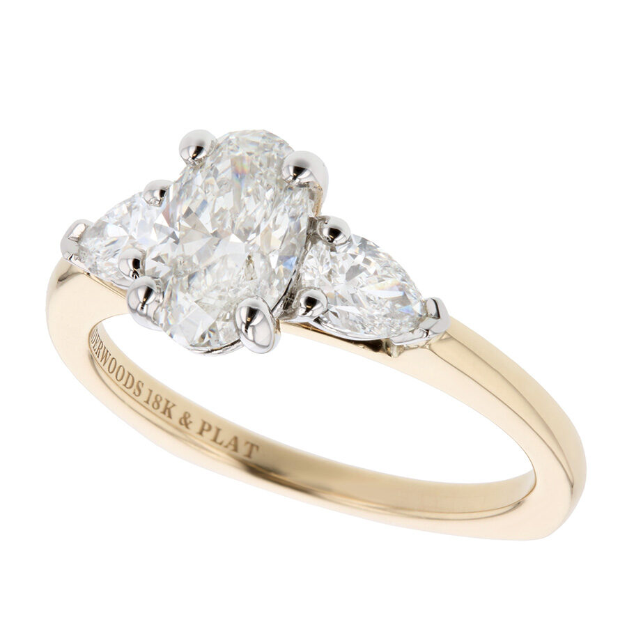 Oval Diamond with Pear Shapes in Yellow Gold Ring
