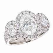 Three Oval Diamonds in Platinum Halo Ring