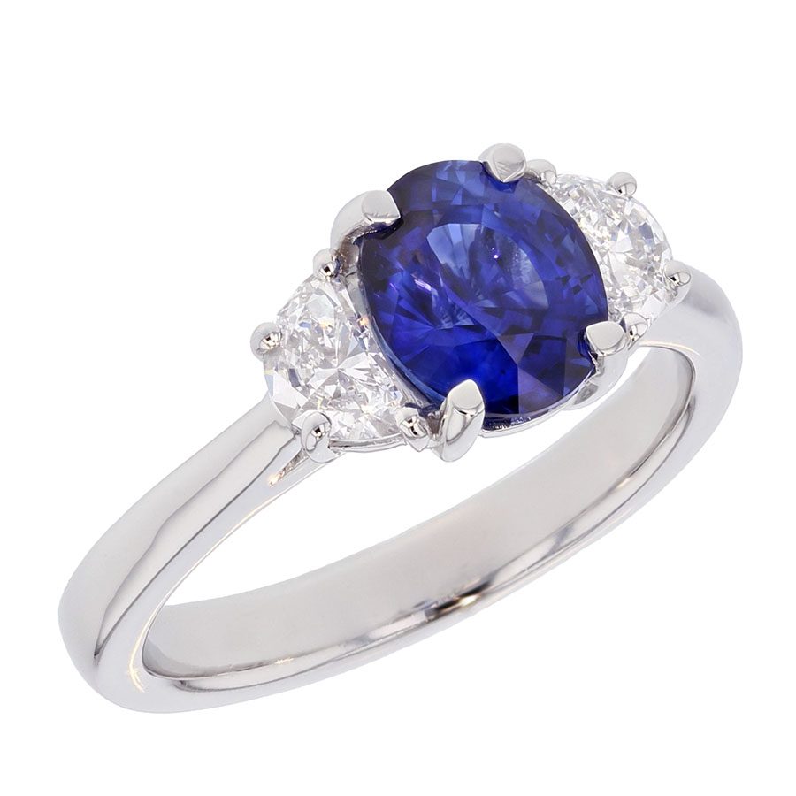 Oval Blue Sapphire with Half Moon Shaped Diamonds in Platinum Ring