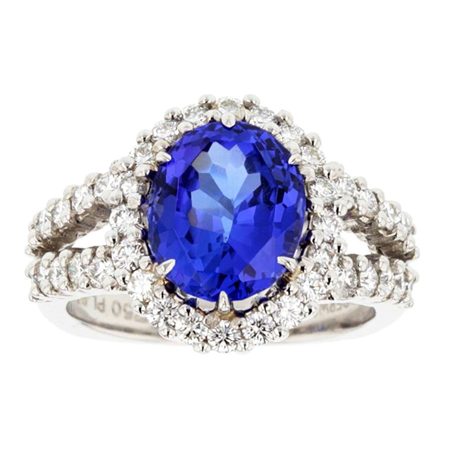 Oval Tanzanite in Diamond Halo Split Shank White Gold Ring