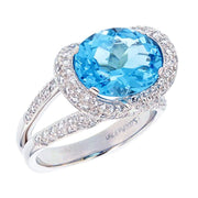 Oval Blue Topaz with Diamonds in White Gold Ring