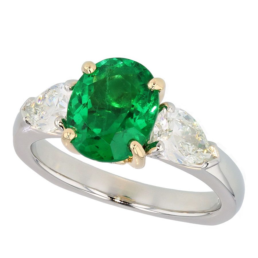Oval Emerald with Pear Shaped Diamonds in Platinum Ring