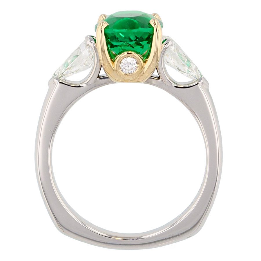 Oval Emerald with Pear Shaped Diamonds in Platinum Ring